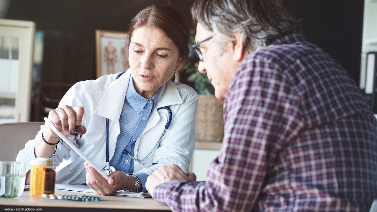 female doctor talking with male patient