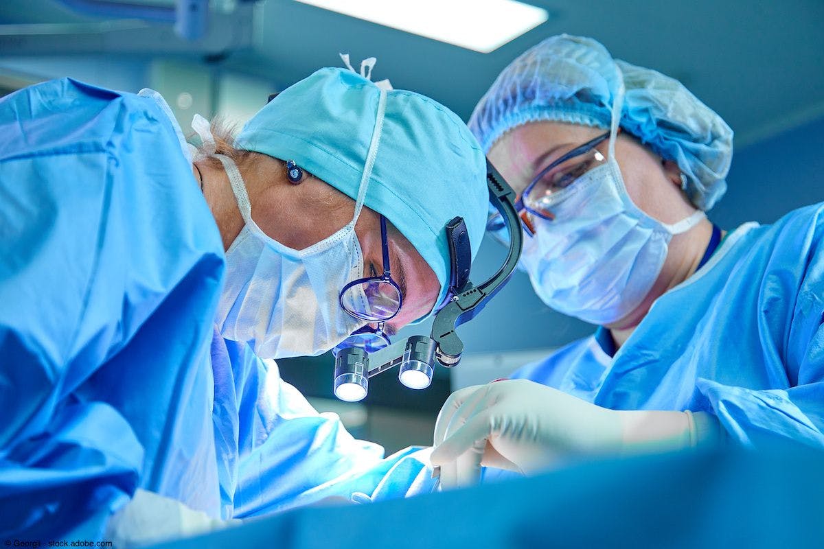 2 surgeons performing surgery