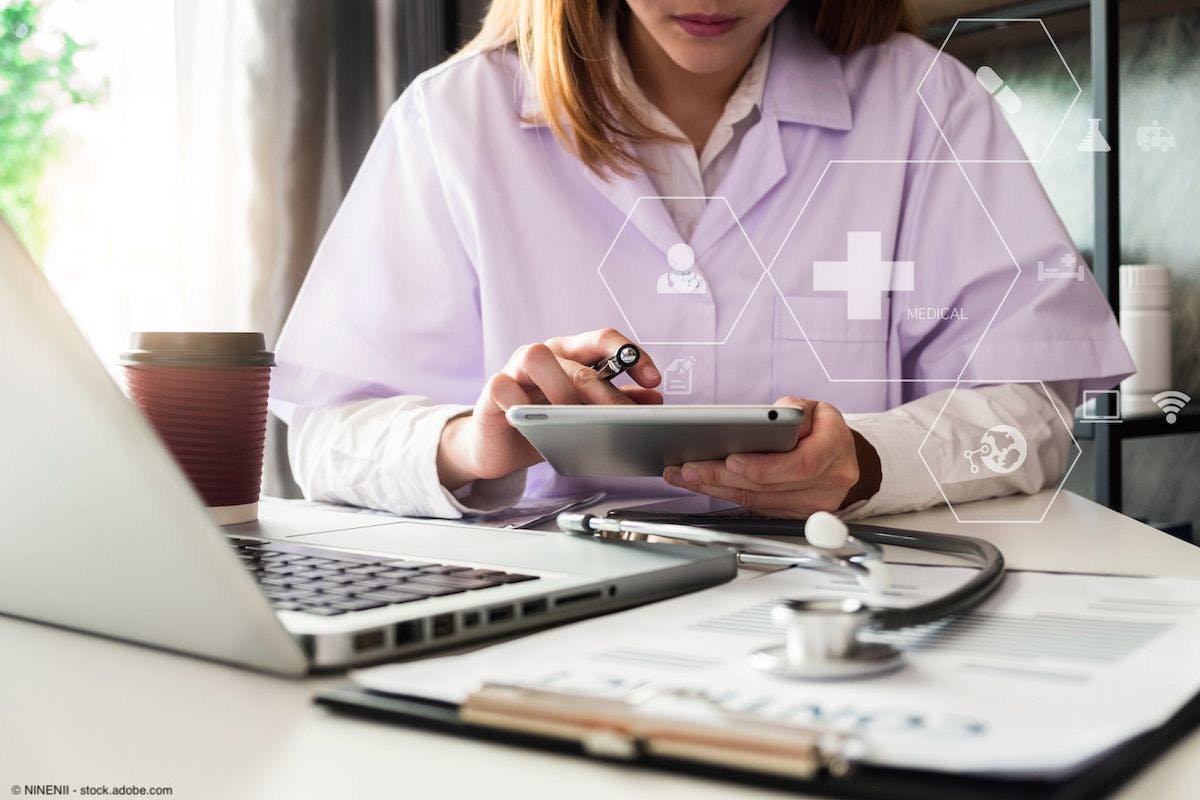 Female doctor working on a tablet | Image Credit: © NINENII - stock.adobe.com